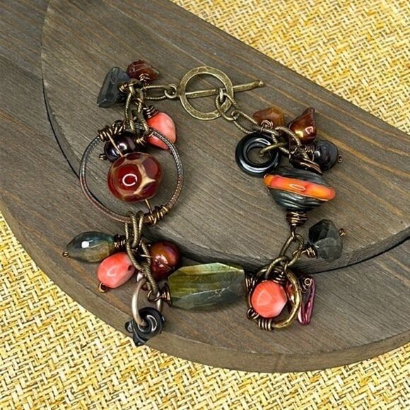 Artistic bracelet with wire wrapped stones.